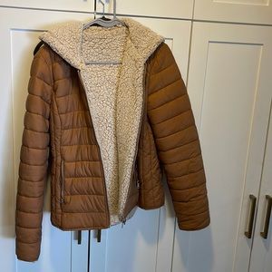 Reversible puffy jacket with faux Sherpa on the inside or outside.